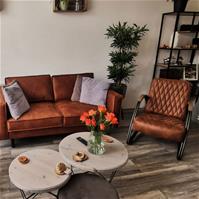 Sfeerfoto Ledersessel Ivy Industrial Design cognac